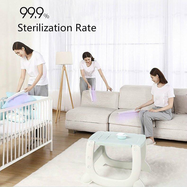 Woman using the 59S UVC LED Sterilizing Wand X5 (White) around the home living room