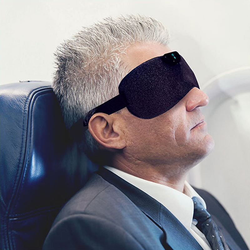 SleepMagic - Smart Anti-Snoring Eye Mask + Sleep Data, man using SleepMagic eye mask while traveling