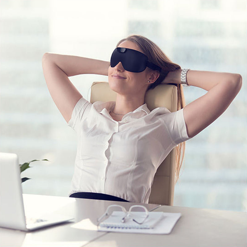 SleepMagic - Smart Anti-Snoring Eye Mask + Sleep Data, woman using SleepMagic eye mask at work desk