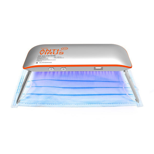 59S UV LED Portable Sterilizer X1 (Silver With Orange) in use disinfecting a face mask