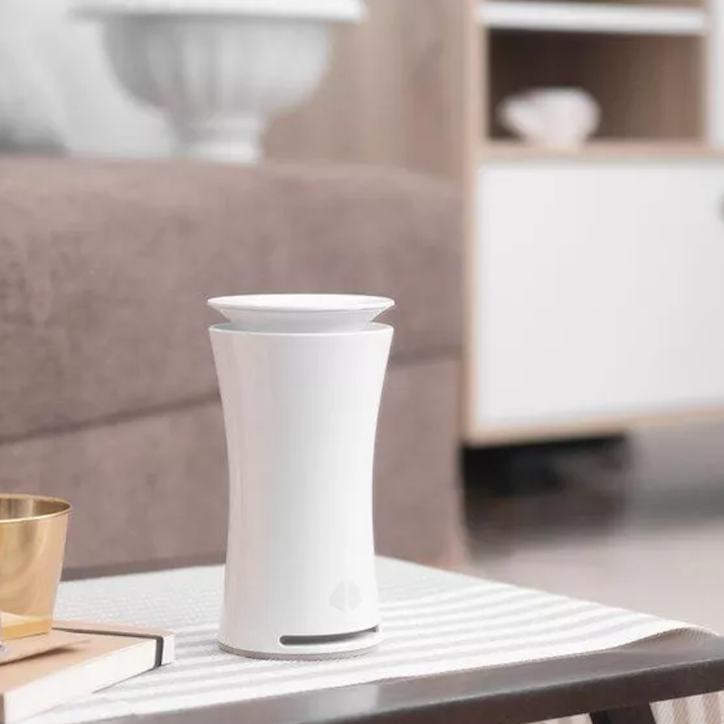  uHoo Indoor Air Sensor – Tracks Nine Air Quality Factors - placed on living room table